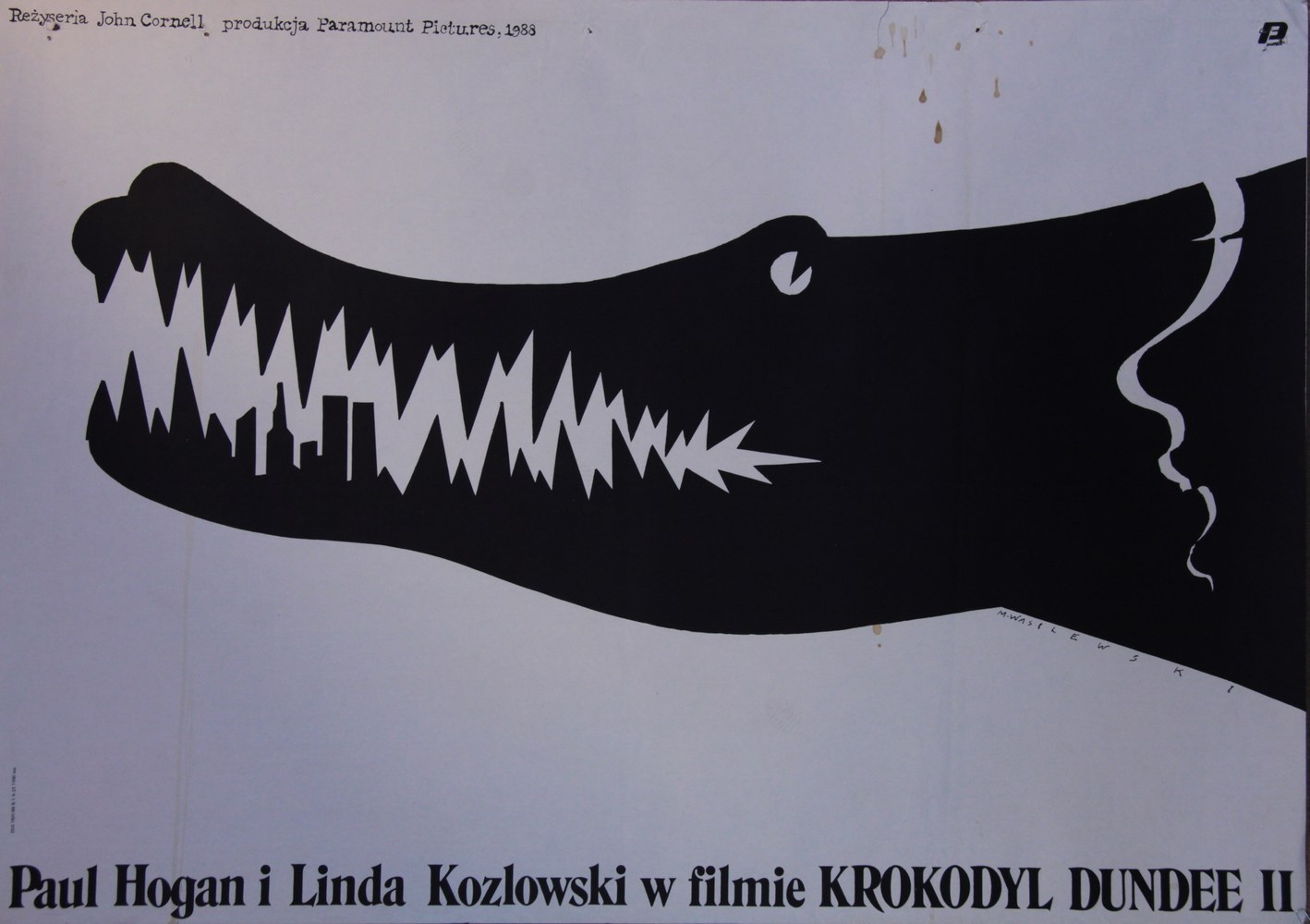 Plakat do filmu “Krokodyl Dundee II” z 1988 roku. Zęby krokodyla uformowane są w nowojorskie wieżowce, m.in. World Trade Center. Projekt plakatu: Mieczysław Wasilewski, 1988.